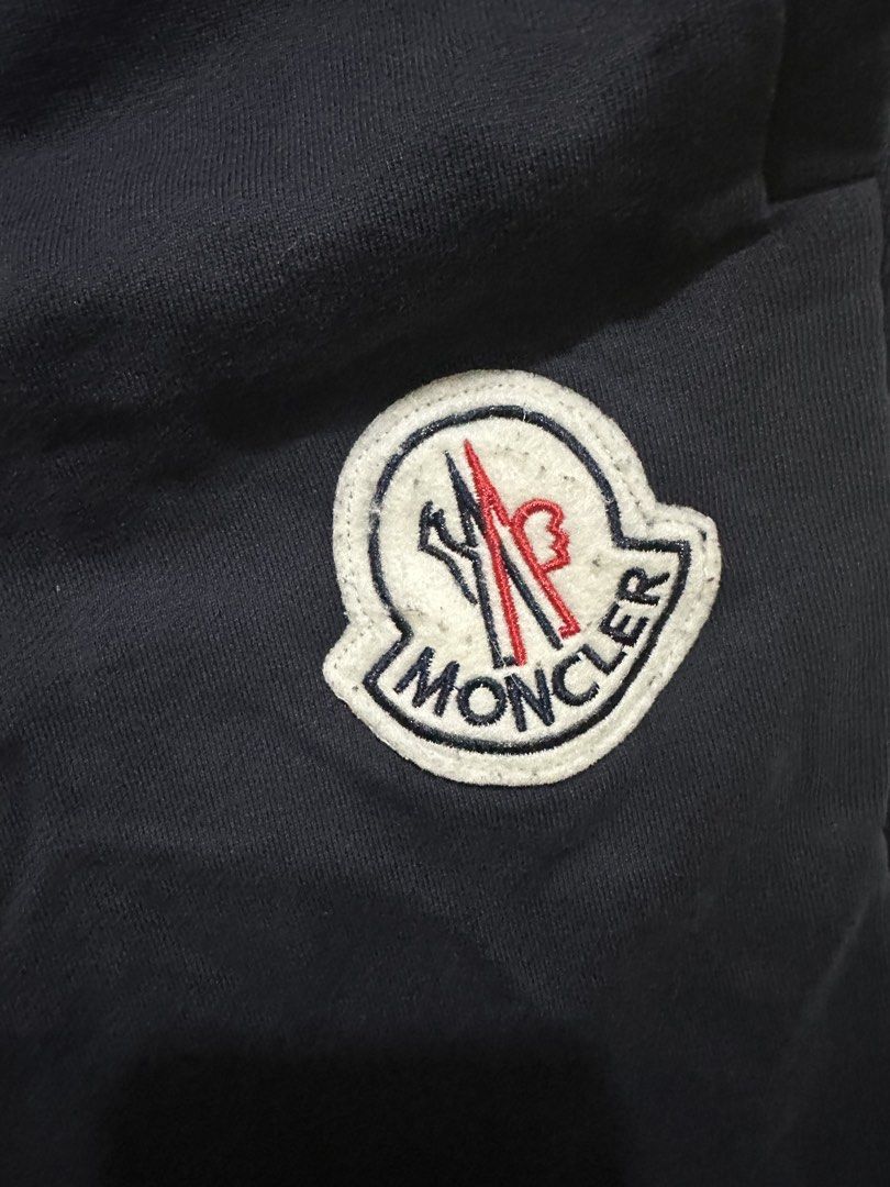 Moncler Navy Blue Sweatpants Size 2 (Category: Joggers) located in Tagum. Submitted by ritarits572 (Listing ID 1463057684, Image 3). Description: - Navy blue Moncler sweatpants - Iconic Moncler logo patch on left leg - Adjustable drawstring waist - Two side pockets and one back pocket - Ribbed cuffs - Made in Italy - Size: 2.