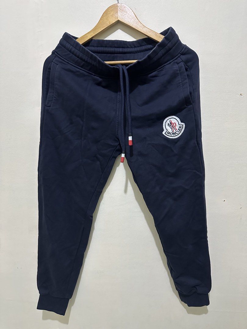 Moncler Navy Blue Sweatpants Size 2 (Category: Joggers) located in Tagum. Submitted by ritarits572 (Listing ID 1463057684, Image 1). Description: - Navy blue Moncler sweatpants - Iconic Moncler logo patch on left leg - Adjustable drawstring waist - Two side pockets and one back pocket - Ribbed cuffs - Made in Italy - Size: 2.