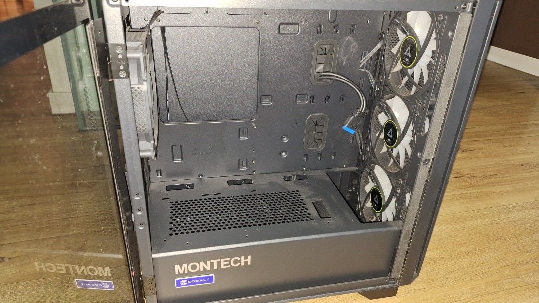 Montech AIR 100 ARGB PC Case (Category: Computer Parts) located in Singapore. Submitted by shibawastaken (Listing ID 1463081967, Image 3). Description: Open to nego! - Montech AIR Black 100 ARGB PC Case - Tempered Glass Side Panel - 3 Front ARGB Fans Included - Spacious Interior for Components - Excellent Airflow Design - Original Box Included - Includes free magnetic dust mesh for front intake fans *Take note the glass panel isn't properly stick