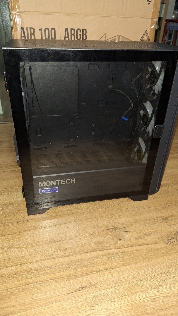 Montech AIR 100 ARGB PC Case (Category: Computer Parts) located in Singapore. Submitted by shibawastaken (Listing ID 1463081967, Image 2). Description: Open to nego! - Montech AIR Black 100 ARGB PC Case - Tempered Glass Side Panel - 3 Front ARGB Fans Included - Spacious Interior for Components - Excellent Airflow Design - Original Box Included - Includes free magnetic dust mesh for front intake fans *Take note the glass panel isn't properly stick