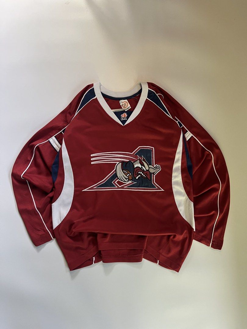 Montreal Alouettes CFL Jersey (Category: Activewear) located in Baler. Submitted by allthrifted31 (Listing ID 1462960558, Image 1). Description: - Montreal Alouettes CFL Jersey - Color: Burgundy with white and navy accents - Features team logo on the front - 'Montreal Alouettes' text on the back collar - Designed for comfort and durability - Perfect for any CFL fan.