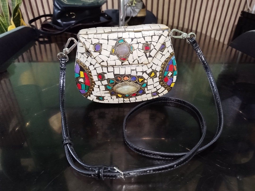 Mosaic Stone Clutch Bag with CK Shoulder Strap (Category: Luxury Bags & Wallets) located in Cabuyao City. Submitted by elaine.toqz (Listing ID 1462913505, Image 1). Description: - Unique mosaic clutch bag - Intricate stone and colorful tile detailing - Detachable black leather strap included ( CK brand) - Secure clasp closure - Ideal statement piece for evenings or special occasions - Approximate dimensions: 6 inches wide x 4 inches tall.