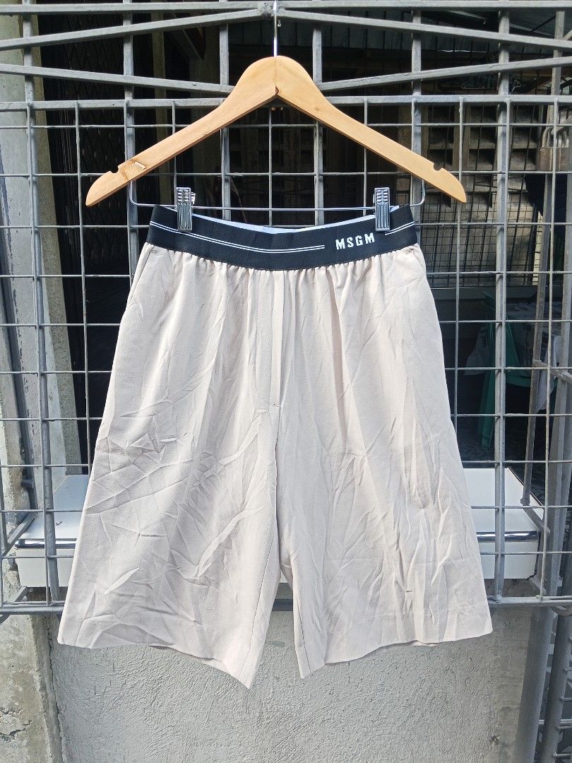 MSGM Beige Culottes Shorts Size 38 (Category: Shorts) located in Lingayen. Submitted by rahzzelula73279 (Listing ID 1463057585, Image 1). Description: - MSGM Culottes Shorts - Color: Beige - Features: Elasticated waistband with MSGM logo detail - Material: Wool, Polyester, Elastane blend - Origin: Made in Italy - Style: Perfect for a casual yet chic look - Condition: Please check photos for details.