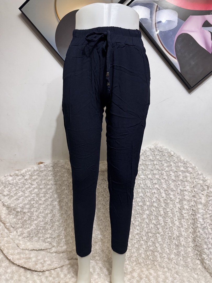 Navy Blue Drawstring Waist Pants (Category: Other Bottoms) located in Marikina City. Submitted by lorradel (Listing ID 1462898368, Image 1). Description: - W: 25-27 L: 34in - new/ never used - Comfortable navy blue pants - Elastic waistband with drawstring tie - Two button details at the front - Side pockets - Cropped length - Ideal for casual wear -mannequin length waist to top ankle 38 in ; to floor 41 inches - MAY HAVE some washable stains (hi