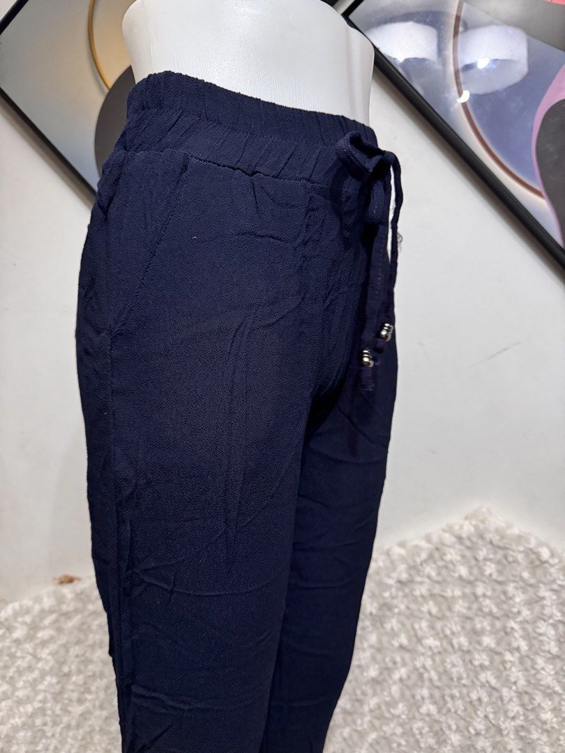 Navy Blue Drawstring Waist Pants (Category: Other Bottoms) located in Marikina City. Submitted by lorradel (Listing ID 1462898368, Image 2). Description: - W: 25-27 L: 34in - new/ never used - Comfortable navy blue pants - Elastic waistband with drawstring tie - Two button details at the front - Side pockets - Cropped length - Ideal for casual wear -mannequin length waist to top ankle 38 in ; to floor 41 inches - MAY HAVE some washable stains (hi