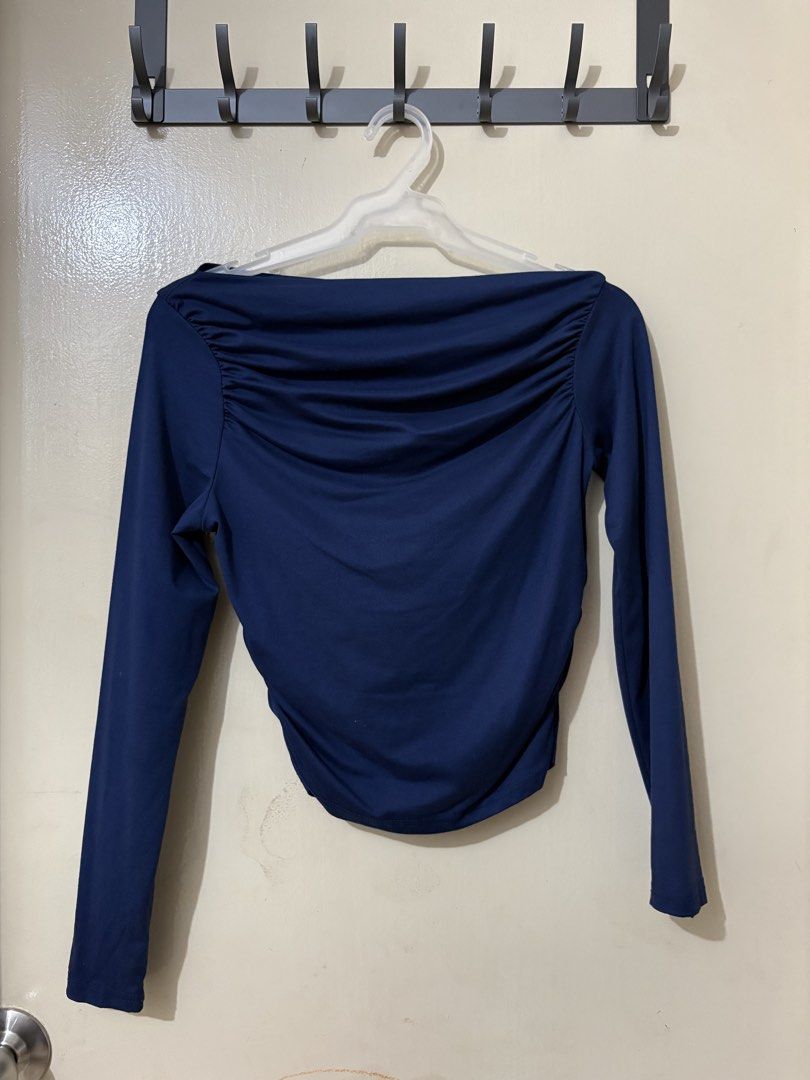Navy Blue Ruched Off-Shoulder Long Sleeve Top (Category: Longsleeves) located in Manila. Submitted by outtacloset (Listing ID 1463010906, Image 1). Description: - Navy blue long-sleeved top - Features ruched detail across the chest - Off-shoulder neckline - Fabric has a nice drape - Versatile: dress up or down - Suitable for night out or casual day.
