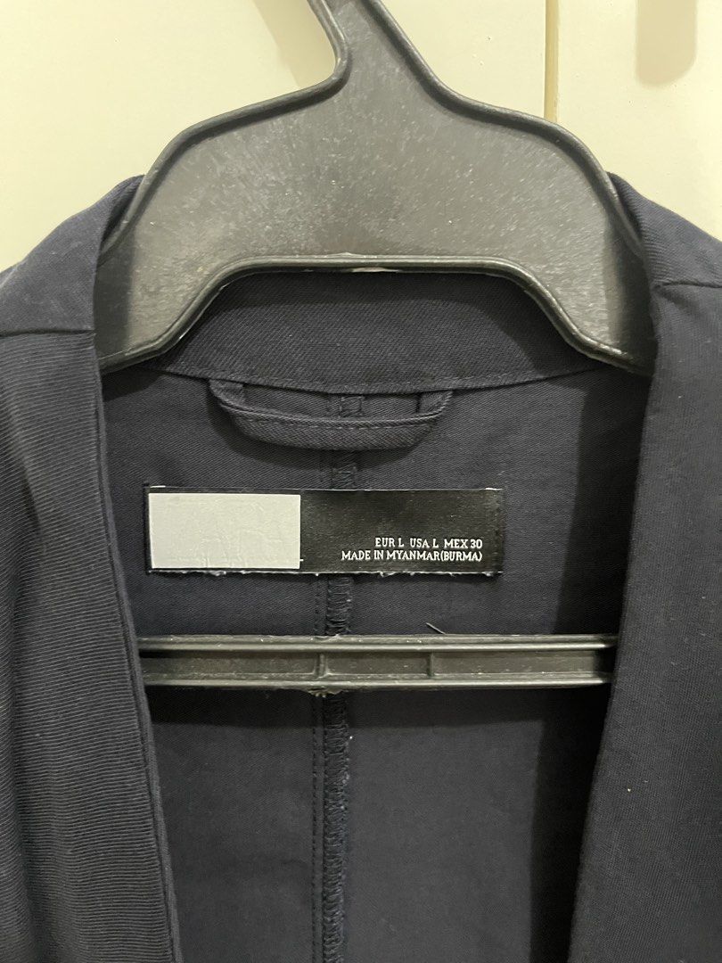 Navy Blue Shawl Blazer (Category: Coats, Jackets and Outerwear) located in Quezon City. Submitted by shoppley (Listing ID 1462954301, Image 3). Description: - Navy blue utility jacket - Drawstring waist for adjustable fit - Roll-up sleeves with tab for securing - Button closure at the front - Ideal for layering over outfits.