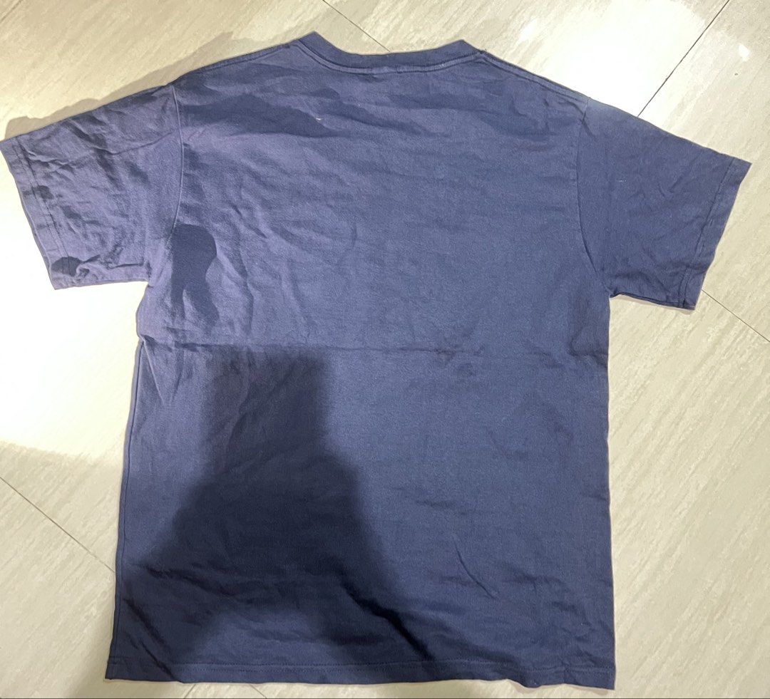Navy Blue T-shirt with Graphic Print (Category: Tshirts & Polo Shirts ) located in Binan City. Submitted by huntwear_.turtle (Listing ID 1463015876, Image 2). Description: - Navy blue t-shirt - Graphic print on front with red and white text - Plain navy back - Ideal for casual wear - Shows some signs of wear.