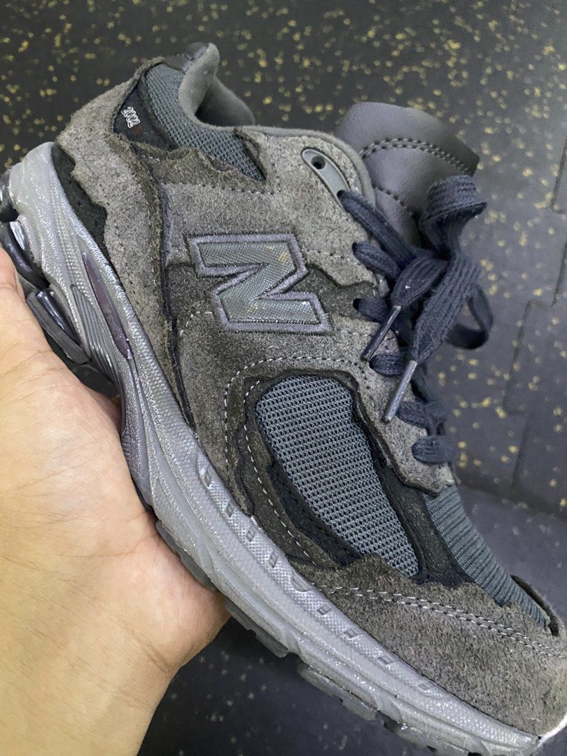 New Balance 2002R distressed-effect sneakers (Category: Sneakers) located in Quezon City. Submitted by capsanywhere (Listing ID 1462888409, Image 3). Description: - Grey New Balance 2002R sneakers - Made with suede and mesh - Features classic N logo on the side - Comfortable sole for all-day wear - Shows some signs of wear (toe box and sole), but plenty of life remaining - Perfect for casual outings and everyday style.
