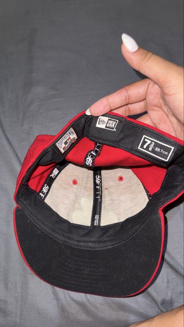 New Era 59FIFTY Cooperstown Red Baseball Cap (Category: Caps & Hats) located in Manila. Submitted by nobleangel (Listing ID 1462921361, Image 3). Description: - Red New Era 59FIFTY Cap - Size: 7 (58.7cm) - Cooperstown Collection logo inside - MLB logo on the back - Minor marks on the brim - Ideal for baseball enthusiasts.