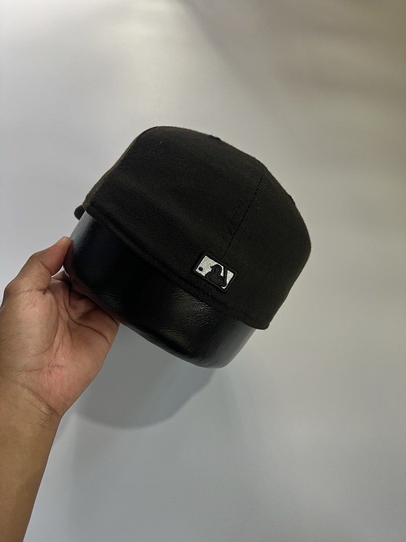New Era 59FIFTY Fitted Cap - Black with White Compass Logo (Category: Caps & Hats) located in Baler. Submitted by allthrifted31 (Listing ID 1462953423, Image 3). Description: - Brand: New Era - Style: 59FIFTY Fitted Cap - Color: Black - Front Logo: White embroidered compass - Side Logo: Classic MLB logo - Interior: New Era branding and sizing sticker - Perfect for: Streetwear outfits.