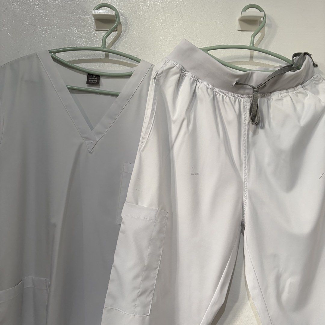 (NiaaHinn) White scrub set (Category: Blouses) located in Quezon City. Submitted by velourine.31 (Listing ID 1462971291, Image 1). Description: May mga mark lang ng ballpen, you can see through pictures RFS: Malaki sakin.