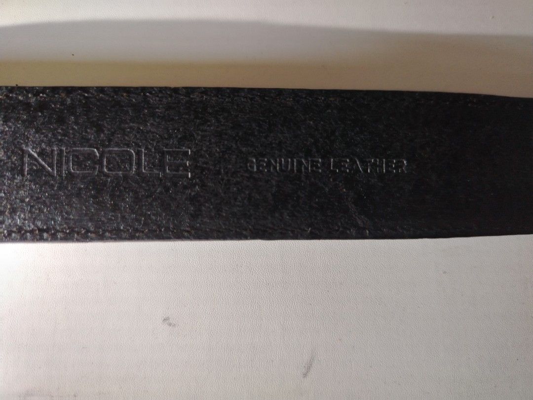 Nicole leather belt (Category: Belts) located in Manila. Submitted by rockandrolly (Listing ID 1462982057, Image 2). Description: Brand: NICOLE Material: 100% genuine leather Color: Black Buckle: Brushed silver-tone metal — engraved NICOLE lettering on keeper & bar Size: Approx 95cm / 38" — fits waist 32–36" Width: Standard 3cm — versatile for pants & jeans Condition: Pre-loved ✅ - Leather sturdy & intact — no cracks, tears, or peeling ​ - Buckle