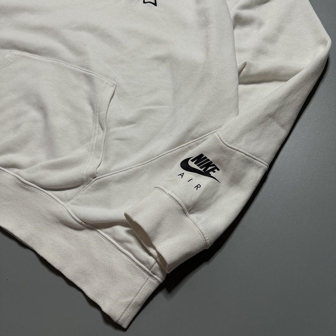 Nike Air White Hoodie Jacket (Category: Coats, Jackets and Outerwear) located in Baguio. Submitted by subaitems (Listing ID 1462901376, Image 3). Description: - White Nike Air hoodie - Features a large 'AIR' graphic on the front - Nike Air logo detail on the sleeve cuff - Comfortable and stylish design - Ideal for casual wear.
