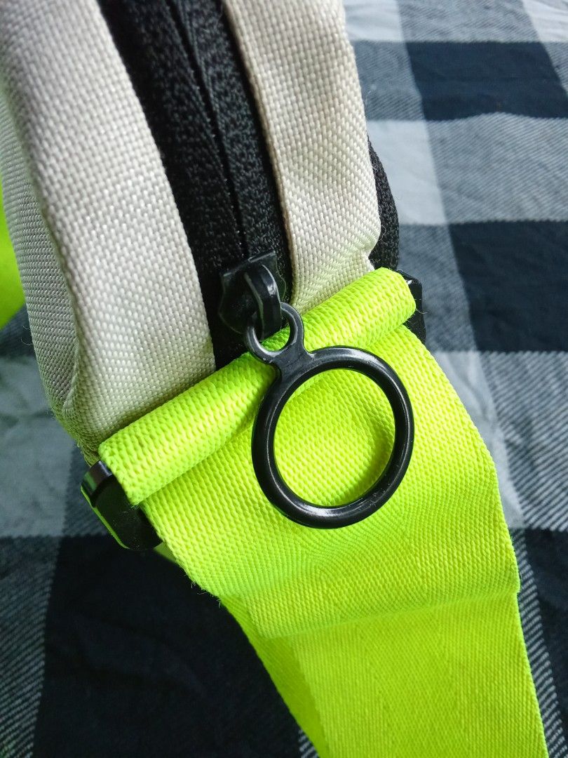 Nike Crossbody Bag Neon Strap (Category: Cross-body Bags) located in Manila. Submitted by timog_high_ice_v2 (Listing ID 1463114798, Image 3). Description: - Nike crossbody bag - Color: Black and grey body - Strap: Bright neon green, adjustable - Design: Large white Nike swoosh - Closure: Zipper with small loop pull - Functionality: Ideal for carrying essentials.