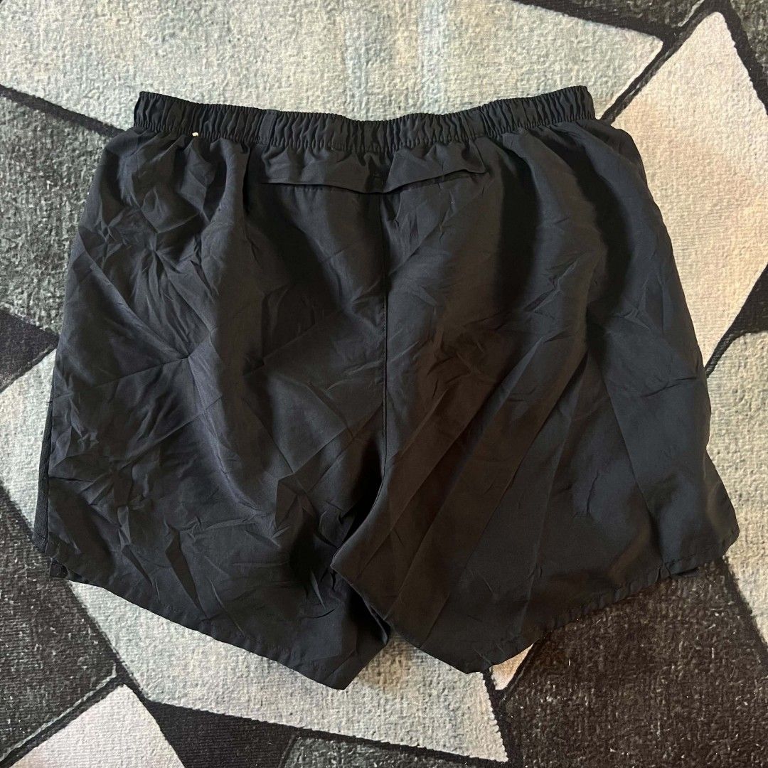 Nike Dri-FIT Running Shorts Black (Category: Activewear) located in Cebu City. Submitted by royalwolf-2a85 (Listing ID 1463025079, Image 2). Description: - Black Nike running shorts - Dri-FIT material for sweat-wicking - Size Large (L) - waist 26 to 30 - length 14 - like New - no issue - Made in Cambodia - Elastic waistband with adjustable drawstring - Small Nike logo detail on the front - Ideal for running, gym workouts, and other athletic activ