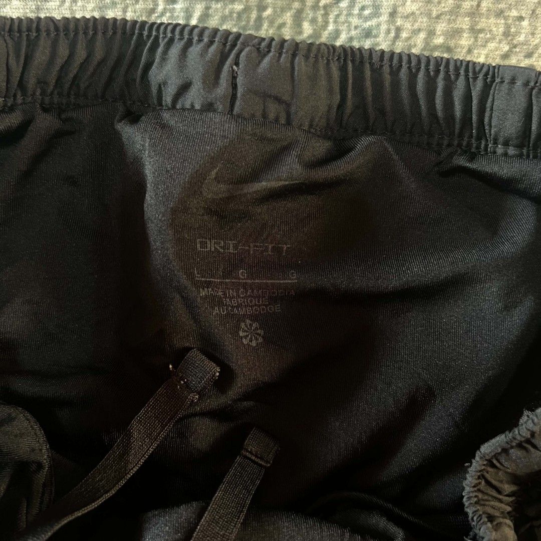 Nike Dri-FIT Running Shorts Black (Category: Activewear) located in Cebu City. Submitted by royalwolf-2a85 (Listing ID 1463025079, Image 3). Description: - Black Nike running shorts - Dri-FIT material for sweat-wicking - Size Large (L) - waist 26 to 30 - length 14 - like New - no issue - Made in Cambodia - Elastic waistband with adjustable drawstring - Small Nike logo detail on the front - Ideal for running, gym workouts, and other athletic activ