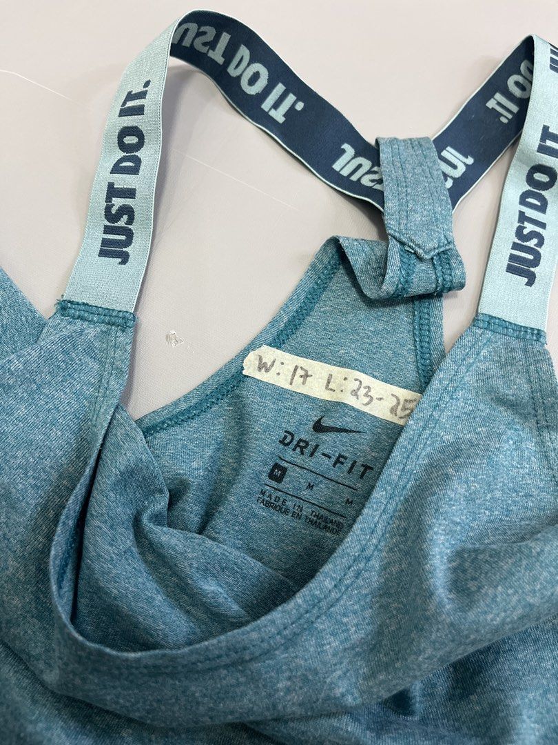 Nike Dri-FIT Teal Tank Top Size M (Category: Activewear) located in Mabalacat. Submitted by aas_thriftfings (Listing ID 1462928514, Image 3). Description: - Teal Nike Dri-FIT tank top - Racerback style with 'Just Do It' straps - Lightweight and breathable fabric - Ideal for workouts or casual wear - Size: Medium.