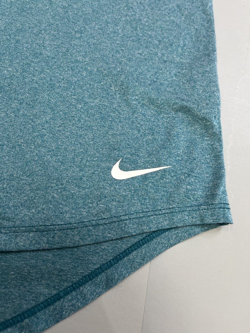 Nike Dri-FIT Teal Tank Top Size M (Category: Activewear) located in Mabalacat. Submitted by aas_thriftfings (Listing ID 1462928514, Image 2). Description: - Teal Nike Dri-FIT tank top - Racerback style with 'Just Do It' straps - Lightweight and breathable fabric - Ideal for workouts or casual wear - Size: Medium.