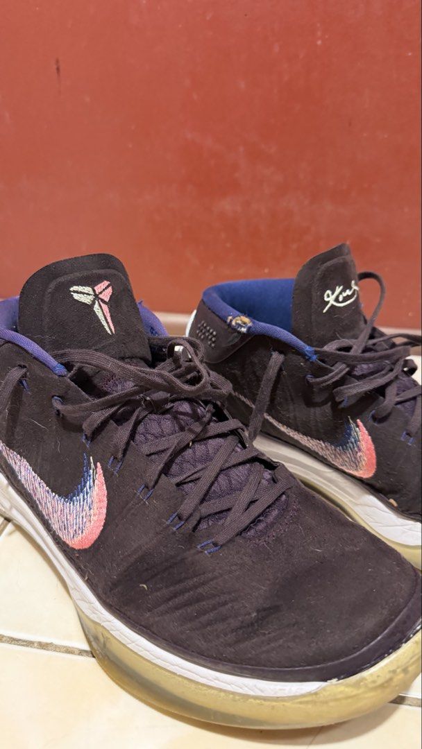 Nike Kobe AD (Category: Sneakers) located in Manila. Submitted by sneakspxxks (Listing ID 1463028441, Image 3). Description: - Nike Kobe Mamba Focus basketball shoes - Color: Dark purple with pink and blue accents on the swoosh - Size: US 12 (UK 11, EUR 46, CM 30) - Manufactured: 11/28/17 - Condition: Some signs of wear on soles and uppers - Ideal for: Basketball or casual wear.