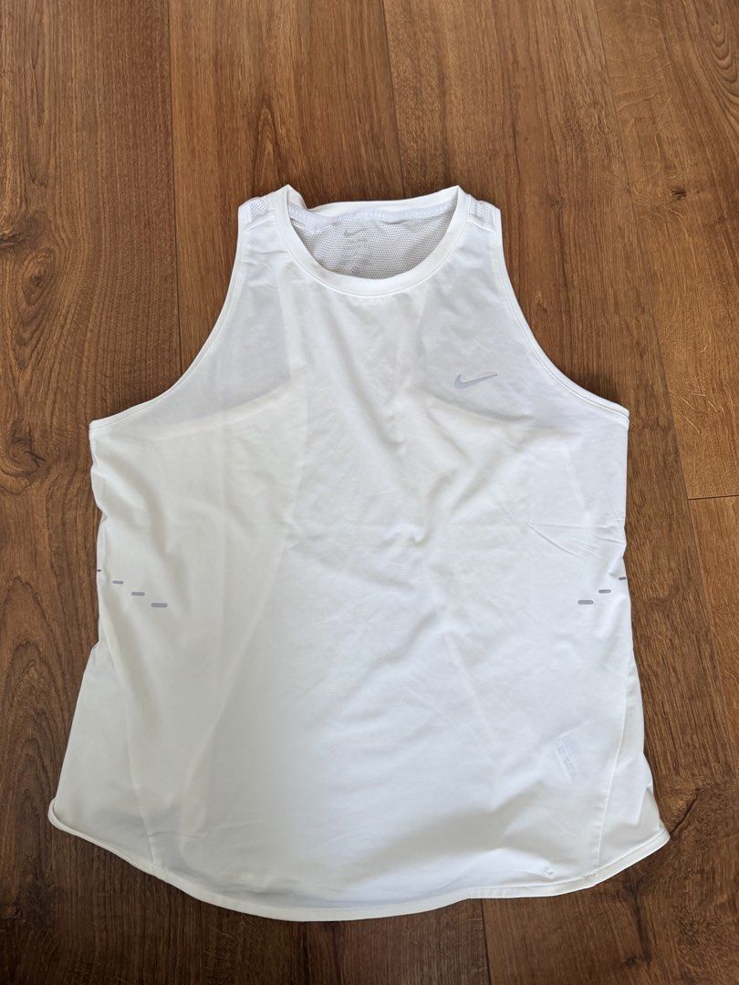 Nike Swift Dri Fit Running Top (Category: Activewear) located in Marikina City. Submitted by nicasandoval (Listing ID 1462902342, Image 1). Description: original price 1,800 bnew (tag was removed) rfs- too big swipe pictures to see details.