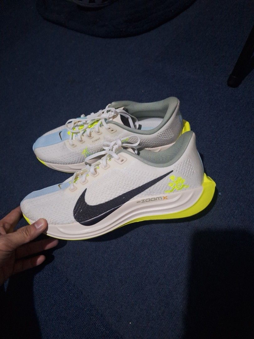 Nike ZoomX Running Shoes (Category: Casual Shoes) located in Manila. Submitted by adolphreyes645 (Listing ID 1463003388, Image 1). Description: - White and neon yellow Nike ZoomX running shoes - Features a breathable Flyknit upper - Ideal for running and training sessions - Experience lightweight and responsive cushioning - Get them now!.
