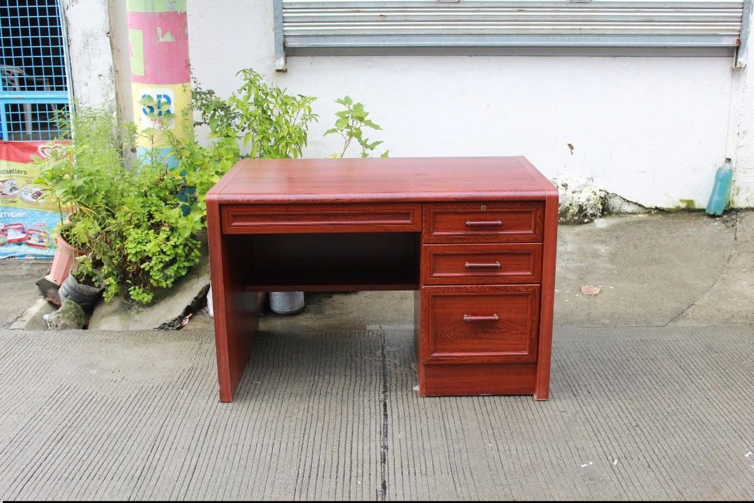 Office Table (Category: Tables & Sets) located in Meycauayan. Submitted by marygracecasimiro (Listing ID 1463070410, Image 2). Description: Wooden Executive Office Desk Classic wooden executive office desk with a rich reddish-mahogany finish, spacious work surface and four drawers. Perfect for offices, supervisors, managers or home workspaces L:44 ¾ • W:26 ¾ • H:29 inches 8,600 pesos only💚 #highlights #followersandnonfollowers.