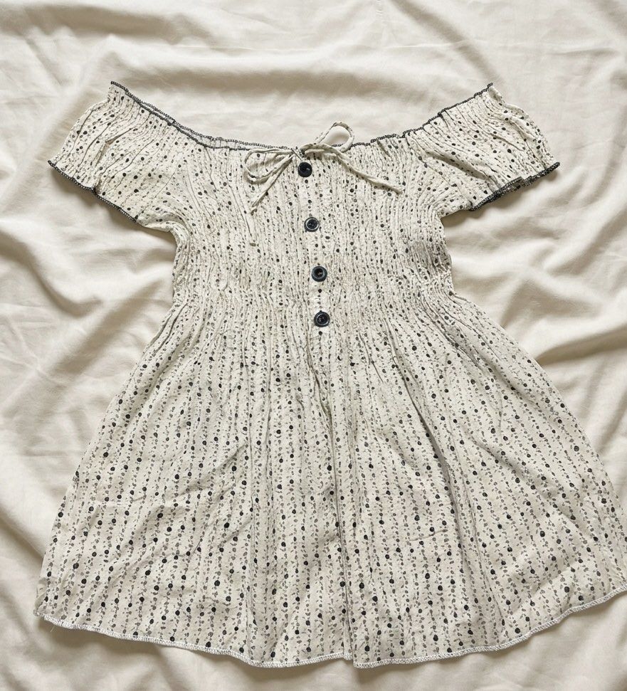 Off-Shoulder Smocked Top with Button Detail (Category: Dresses) located in Manila. Submitted by goldenprngs101 (Listing ID 1463086730, Image 1). Description: - Cute off-shoulder design - Smocked bodice with button front - Short sleeves with ruffled hem - All-over small floral print - Comfortable and easy to wear - Ideal for casual days or picnics WW: 14”.