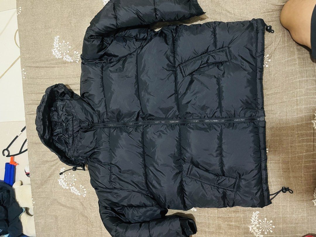 OHC Black Hooded Puffer Jacket (Category: Coats, Jackets and Outerwear) located in Manila. Submitted by athan0800 (Listing ID 1463022492, Image 1). Description: - Black puffer jacket with a hood - Zip-up front with convenient pockets - Adjustable drawstrings at the hem for a snug fit - Ideal for staying warm and casual wear - Made with polyester (check label for specific material details).