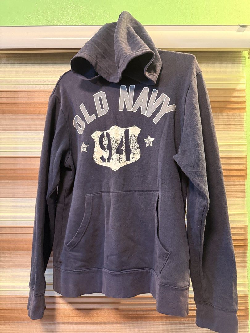 Old Navy 94 Hoodie (Category: Hoodies) located in Caloocan City. Submitted by johnpaulj (Listing ID 1462919001, Image 1). Description: SIZES: A = 23 Inches B = 20 Inches - Classic Old Navy hoodie - Dark navy color with '94' graphic - Front pocket - Hooded design - Ideal for casual wear and layering.