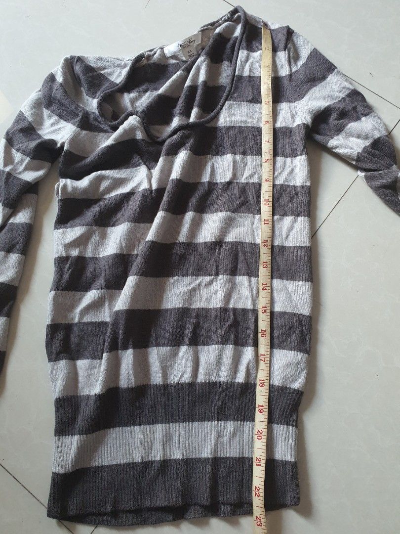 Old navy knitted stripe longsleeve (Category: Longsleeves) located in Meycauayan. Submitted by shoptoown (Listing ID 1462920060, Image 3). Description: - Grey and white striped long-sleeved top - Comfortable scoop neckline - Lightweight knit fabric - Approx. 15 inches length (shoulder to hem) - Approx. 18 inches width (chest) - Versatile for layering or standalone wear - has a hole on the underarm side, can be stitched.