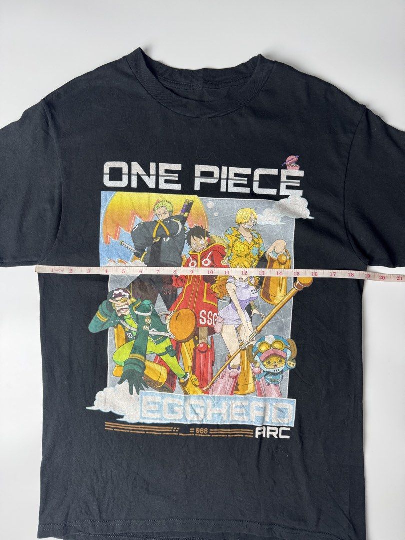 One Piece Egghead Arc Black Graphic T-Shirt (Category: Tshirts & Polo Shirts ) located in Cavite. Submitted by dracokidstuff (Listing ID 1463012236, Image 2). Description: - Black t-shirt featuring One Piece characters from the Egghead Arc. - Includes popular characters like Luffy, Zoro, Nami, and Chopper. - High-quality, durable print. - Ideal gift or addition for any One Piece fan. - Size not specified; please refer to measurements if provided.