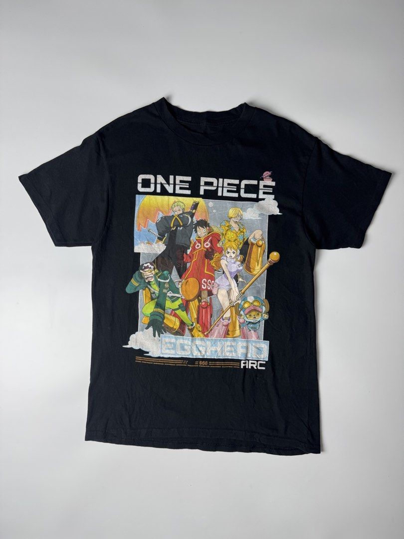 One Piece Egghead Arc Black Graphic T-Shirt (Category: Tshirts & Polo Shirts ) located in Cavite. Submitted by dracokidstuff (Listing ID 1463012236, Image 1). Description: - Black t-shirt featuring One Piece characters from the Egghead Arc. - Includes popular characters like Luffy, Zoro, Nami, and Chopper. - High-quality, durable print. - Ideal gift or addition for any One Piece fan. - Size not specified; please refer to measurements if provided.