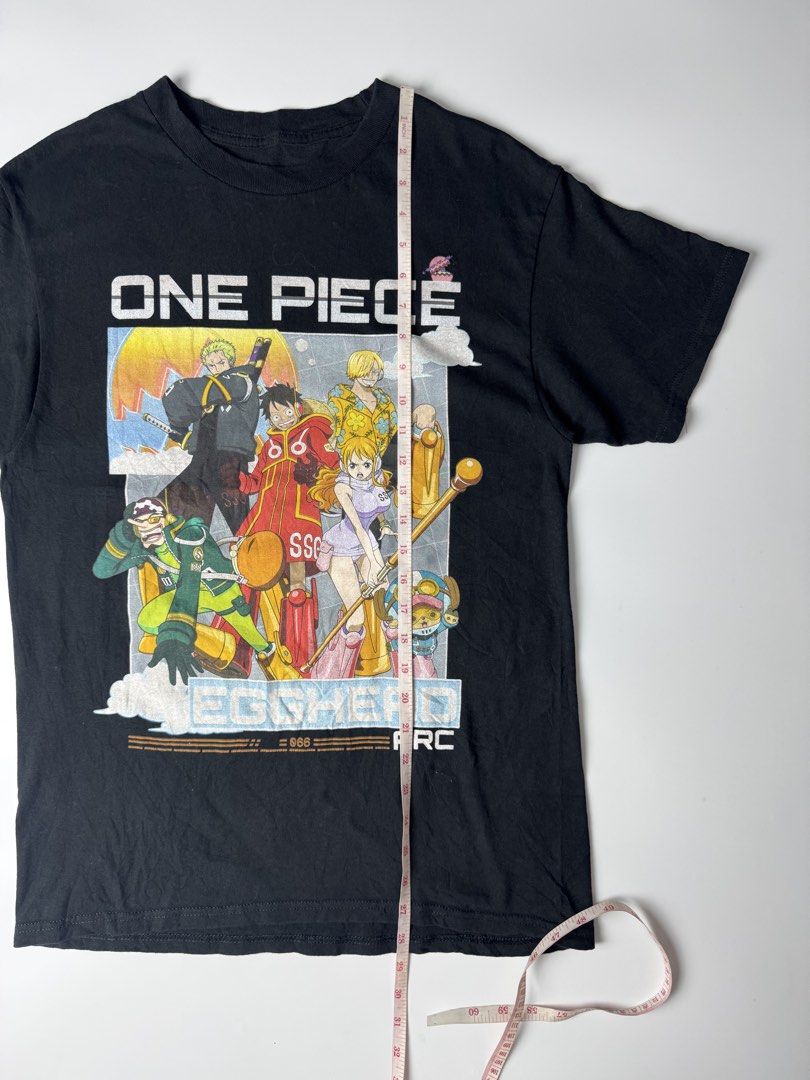 One Piece Egghead Arc Black Graphic T-Shirt (Category: Tshirts & Polo Shirts ) located in Cavite. Submitted by dracokidstuff (Listing ID 1463012236, Image 3). Description: - Black t-shirt featuring One Piece characters from the Egghead Arc. - Includes popular characters like Luffy, Zoro, Nami, and Chopper. - High-quality, durable print. - Ideal gift or addition for any One Piece fan. - Size not specified; please refer to measurements if provided.
