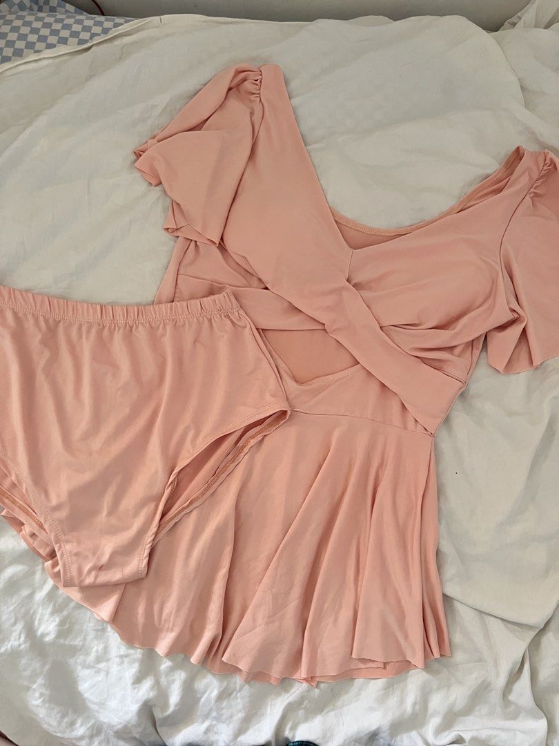 One-Piece Swimsuit with Skirted Bottom (Category: Bikinis & Swimsuits) located in Manila. Submitted by happydani (Listing ID 1462964063, Image 2). Description: - Plussize - curvy - Cute pink one-piece swimsuit - Flattering wrap-around top - Flowy skirted bottom - Ruffled, fluttery sleeves - Ideal for beach or pool - Comfortable and stylish .