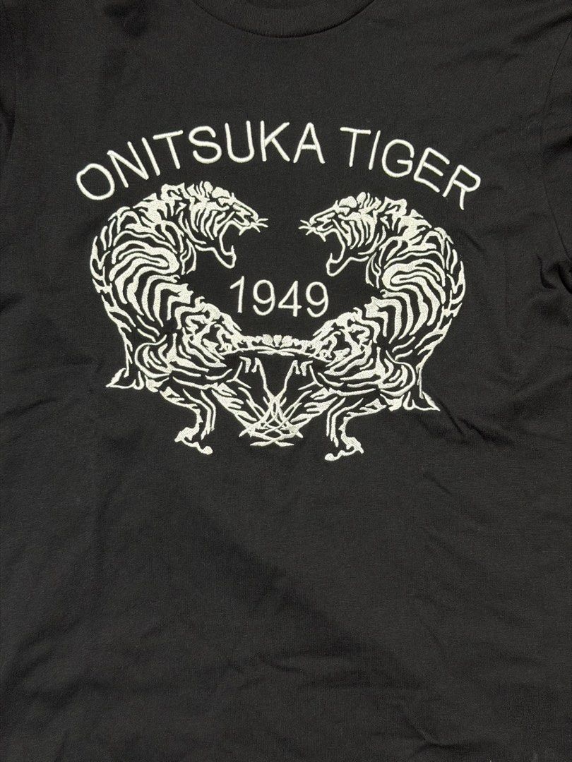 Onitsuka Tiger Black T-Shirt Size M (Category: Tshirts & Polo Shirts ) located in Mandaluyong City. Submitted by nobleowl.e8ef7a (Listing ID 1462949189, Image 3). Description: - Brand: Onitsuka Tiger - Color: Black - Size: Medium (M) 17x26 - Material: Comfortable Cotton - Features: Iconic tiger graphic and '1949' print - Style: Great for casual wear .