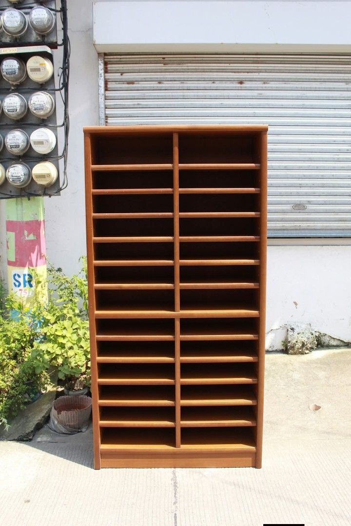Open Shelves (Category: Shelves, Cabinets & Racks) located in Meycauayan. Submitted by marygracecasimiro (Listing ID 1463049722, Image 2). Description: 26-Slot Wooden Literature Organizer / Bookshelves Sturdy frame, heavy and a warm teak-style finish. Perfect for organizing documents, mail, magazines, office supplies, shoes or craft materials. Ideal for offices, home workspaces and creative storage solutions L:35 ¾ • W:12 • H:71 inches 11,900 pes
