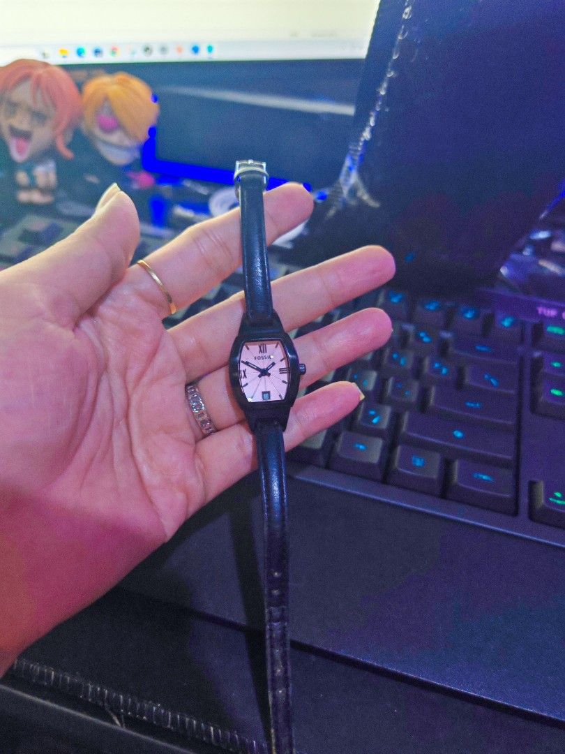 Orig Fossil Watch (Category: Women's Watches) located in Taguig. Submitted by mystuff4youph (Listing ID 1463065931, Image 1). Description: - Pretty pink dial Fossil watch - Black leather strap orig strap - Dark case (black or dark gunmetal) - Roman numeral hour markers - Small and dainty design - no issue perfectly working - may slight sign of wear sa leather strap pero minimal lang, overall very nice pa - Versatile for everyday wear or dressing 