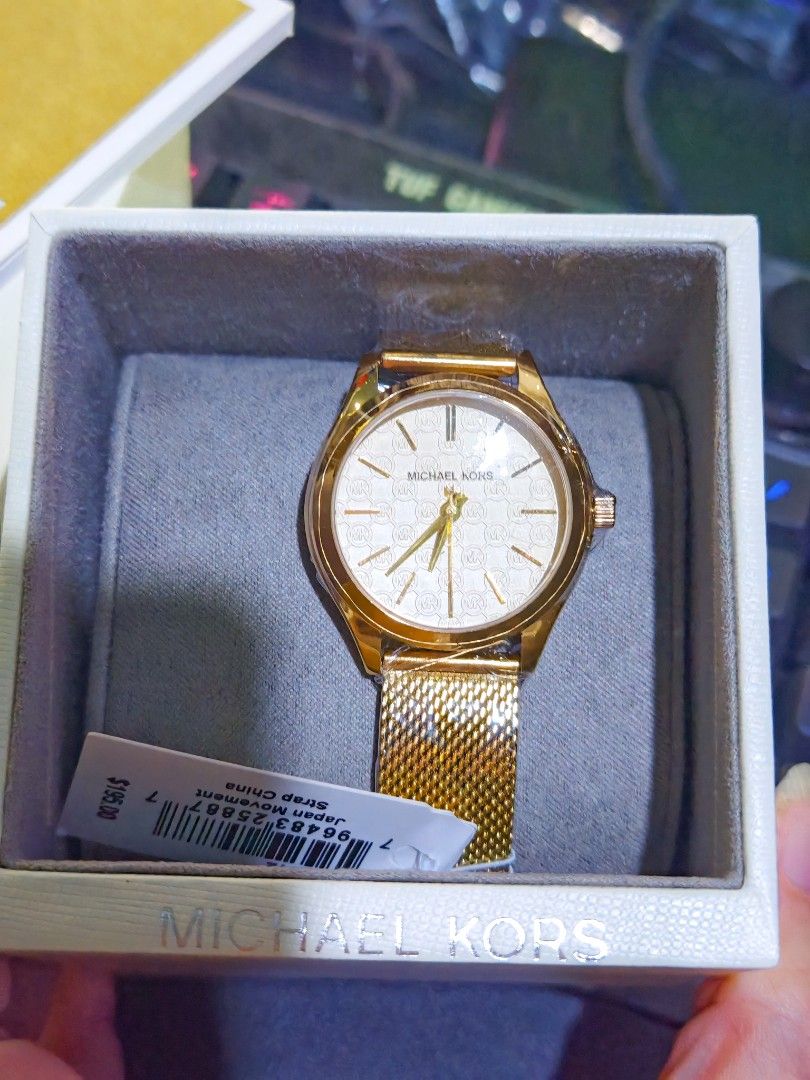 Original Michael Kors Gold Mesh Strap Watch (Category: Women's Watches) located in Taguig. Submitted by mystuff4youph (Listing ID 1463050566, Image 2). Description: - Authentic Gold Michael Kors Watch - Elegant White Patterned Dial - Adjustable Mesh Strap for a Perfect Fit - Comes with Original Box and Tag - Reliable Japan Movement - Original Price: $195.00 or 11K pesos - Perfect Gift Idea! - Guaranteed Orig or get your moneyback - Bought from Ja