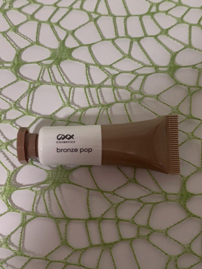 OXX Cosmetics Bronze Pop Liquid Bronzer in Sunkissed (Category: Makeup) located in Mandaluyong City. Submitted by newandlovedco. (Listing ID 1462926753, Image 1). Description: - OXX Cosmetics Bronze Pop liquid bronzer - Shade: Sunkissed - Provides a beautiful, natural glow - Easy to blend formula - Convenient tube packaging with cap - Ideal for achieving a sunkissed makeup look - Opened in Sept 2026, used twice.