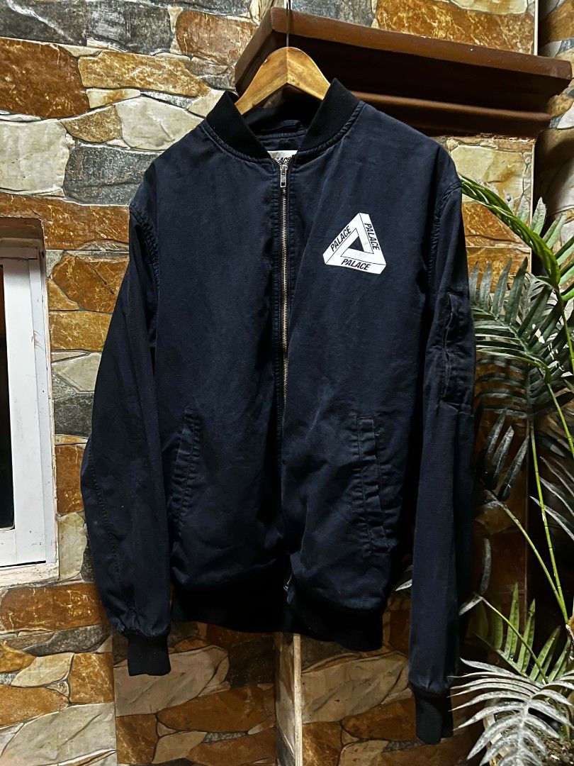 Palace Skateboards Ripstop Bomber Jacket XL Black (Category: Coats, Jackets and Outerwear) located in Taguig. Submitted by gakuyen.3 (Listing ID 1462931907, Image 1). Description: - Brand: Palace - Item: Bomber Jacket - Color: Black - Material: Ripstop Cotton - Size: XL - Features: Iconic Palace triangle logo on chest, zipper closure - Style: Great for everyday wear - Condition: Please check photos for details 25x30 dimension.