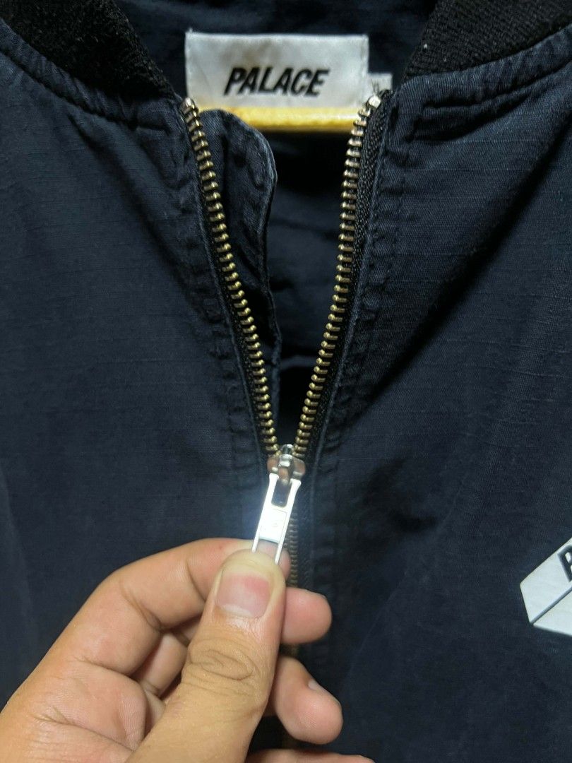Palace Skateboards Ripstop Bomber Jacket XL Black (Category: Coats, Jackets and Outerwear) located in Taguig. Submitted by gakuyen.3 (Listing ID 1462931907, Image 2). Description: - Brand: Palace - Item: Bomber Jacket - Color: Black - Material: Ripstop Cotton - Size: XL - Features: Iconic Palace triangle logo on chest, zipper closure - Style: Great for everyday wear - Condition: Please check photos for details 25x30 dimension.