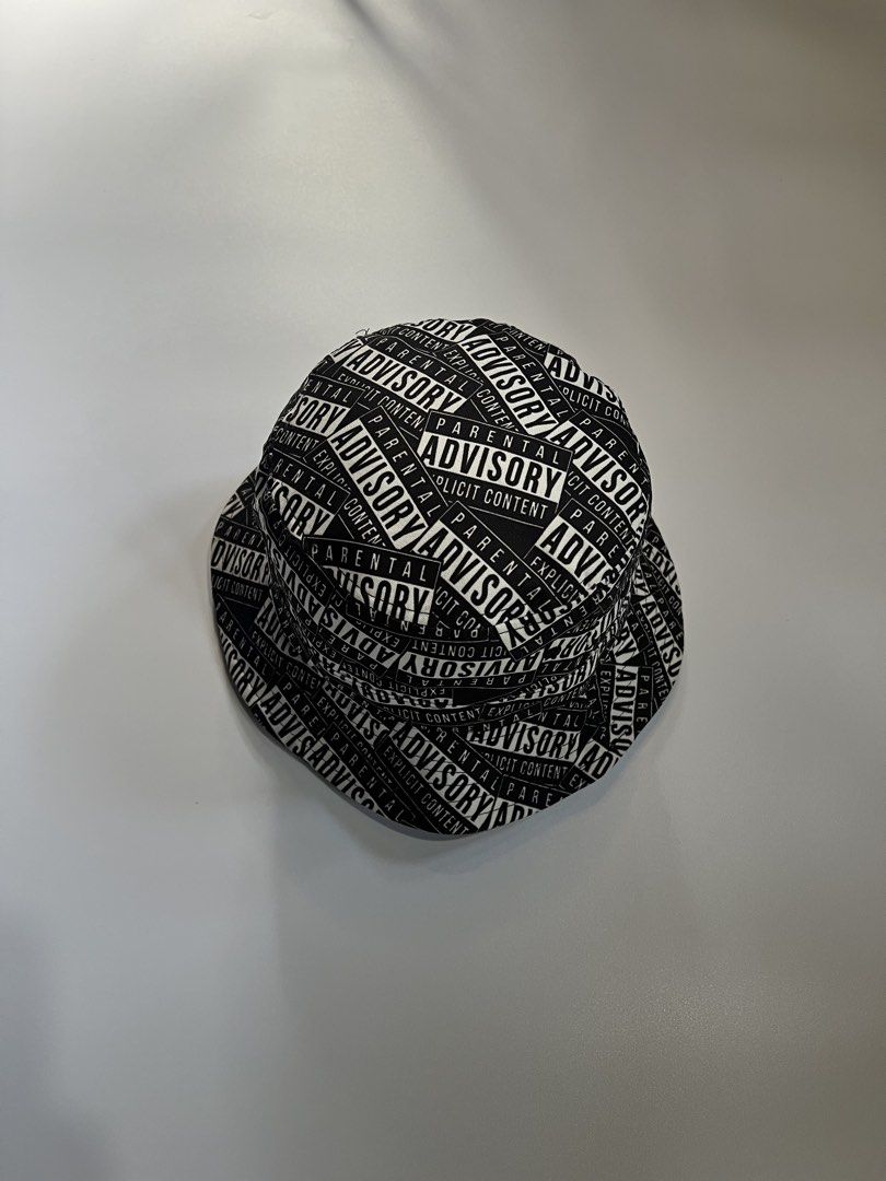 Parental Advisory Explicit Content Bucket Hat (Category: Hats & Beanies) located in Baler. Submitted by allthrifted31 (Listing ID 1462952922, Image 1). Description: - Black bucket hat - All-over 'Parental Advisory Explicit Content' print - Standard adult size - Ideal for festivals or adding an edgy vibe to your outfit.