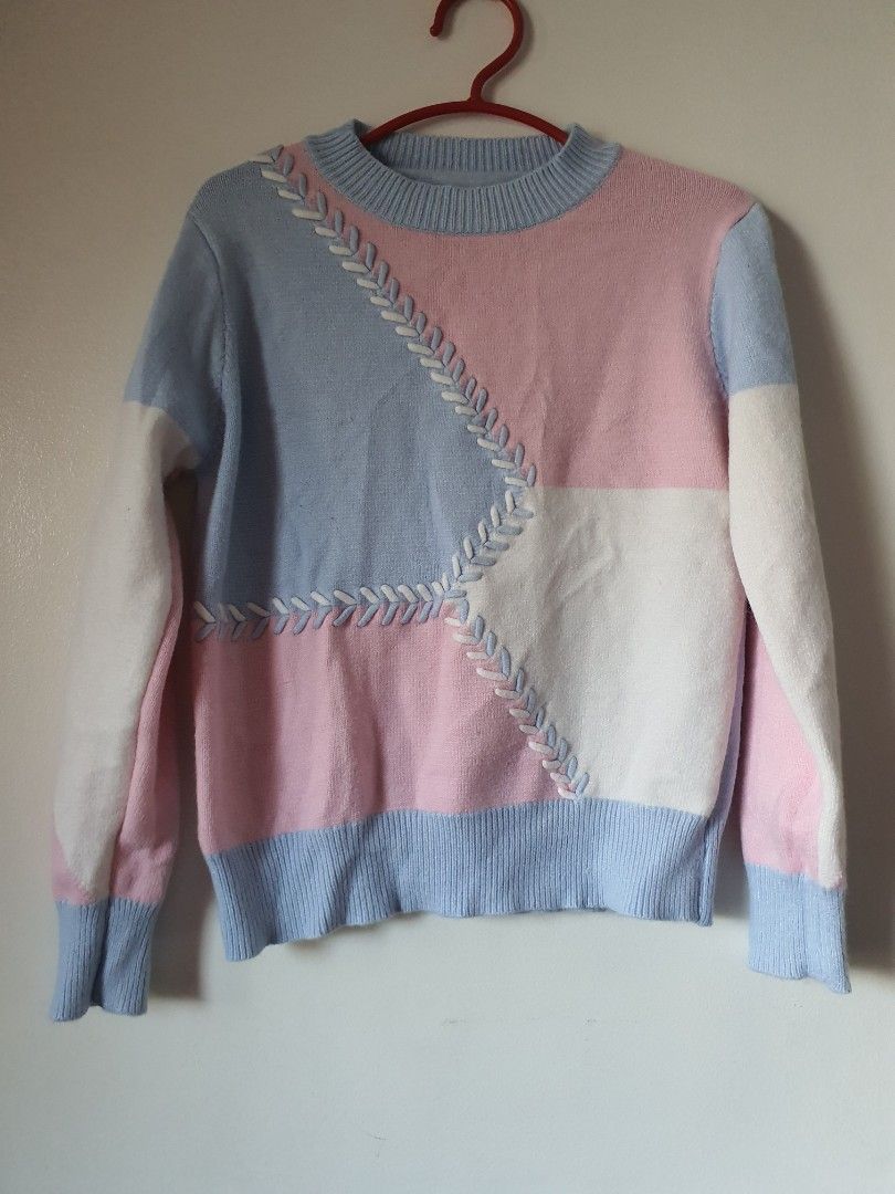 Patchwork Colorblock Knit Sweater with Decorative Stitching (Category: Longsleeves) located in Meycauayan. Submitted by shoptoown (Listing ID 1462978505, Image 1). Description: - Cute pastel patchwork sweater - Features light blue, pink, and white panels - Decorative white stitching connects sections - Ribbed cuffs and neckline for a cozy fit - Stylish and perfect for a casual look.