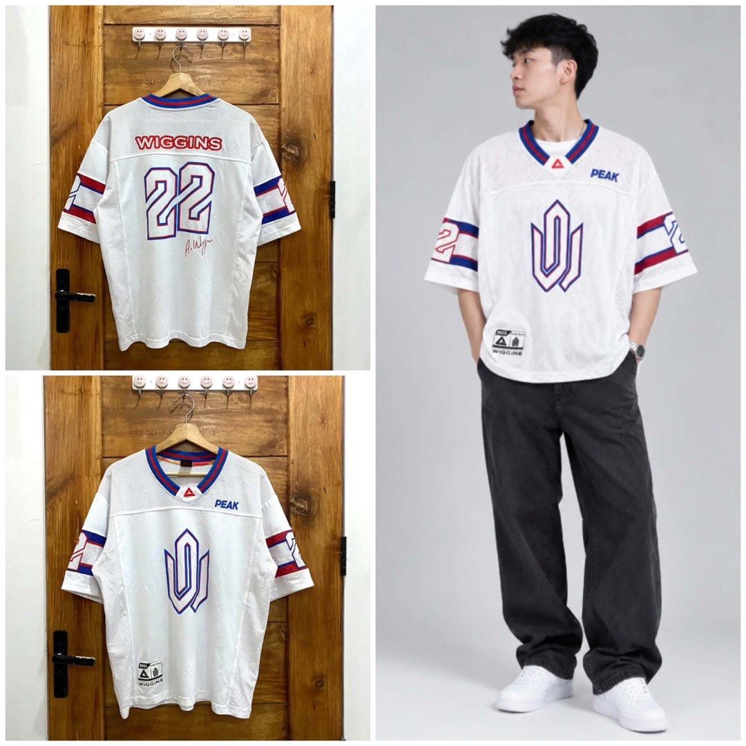 PEAK Wiggins 22 Basketball Jersey White (Category: Activewear) located in El Nido. Submitted by dominicsal76603 (Listing ID 1463057887, Image 1). Description: - White PEAK basketball jersey - Features Wiggins and number 22 on the back - PEAK logo on the front - Red and blue stripes on sleeves - Made with breathable mesh fabric - Ideal for basketball, sports, or casual wear.