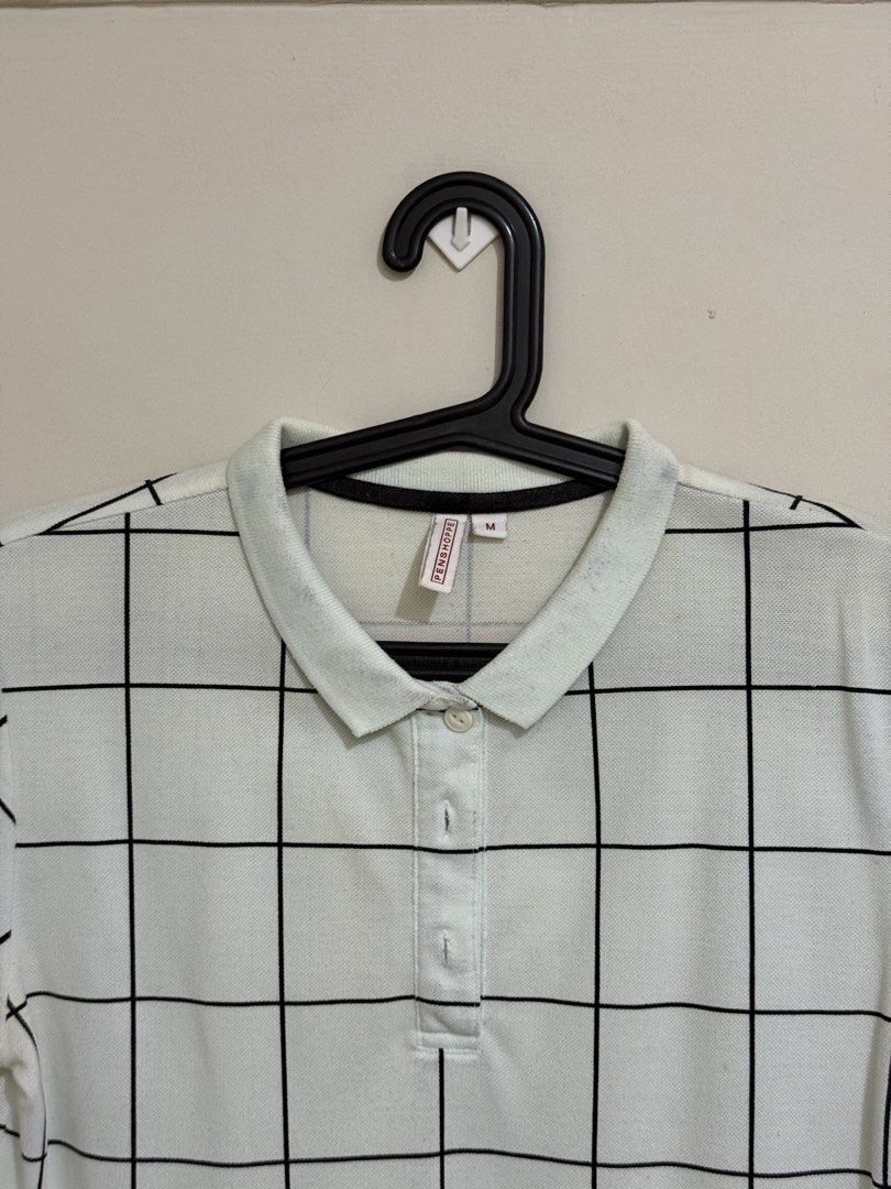 Penshoppe White Grid Polo Shirt (Category: Blouses) located in San Pedro. Submitted by itsminaxvii (Listing ID 1463021052, Image 2). Description: - White polo shirt - Black grid pattern - Short sleeves with black trim - Button-up neckline.