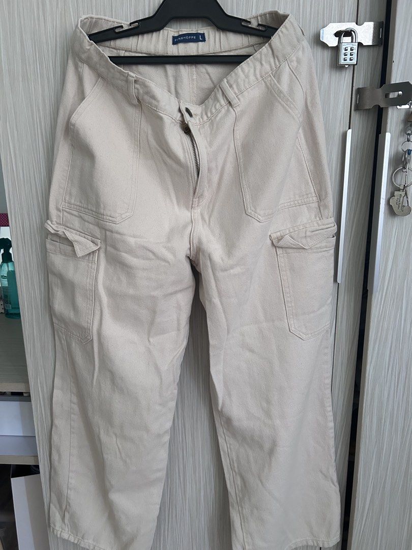 PENSHPPE Beige Cargo Pants Size L (Category: Other Bottoms) located in Manila. Submitted by juvy13 (Listing ID 1462903423, Image 1). Description: - Beige cargo pants from PENSHPPE - Size: L - Closure: Zipper and button front - Features: Multiple pockets on front and sides - Material: Sturdy cotton twill fabric - Style: Great for casual wear.