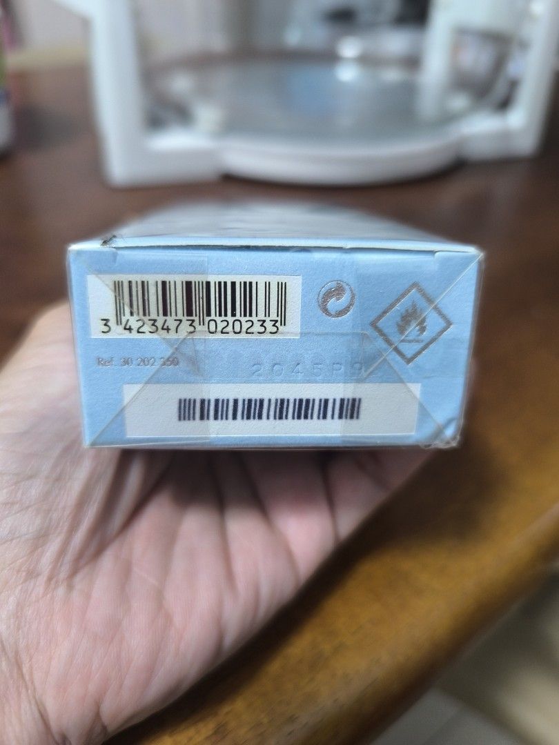Perfume Box with Barcode and Symbols (Category: Fragrance & Deodorants) located in Rizal. Submitted by chefems0721 (Listing ID 1462939949, Image 2). Description: - Light blue perfume box - Includes barcode and reference number: 30 202 250 - Features recycling symbol - Features flammable symbol.