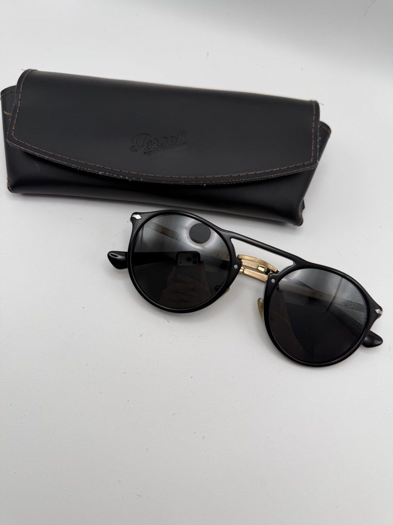 Persol Polarized Gold Temple Black Frame (Category: Sunglasses & Eyewear) located in Manila. Submitted by rj_authenticwatchesandmore (Listing ID 1462980778, Image 2). Description: Persol PO3264s - retails for 32,000 php - Polarized crystal lens - black acetate frame, gold tone temples - 50mm lens size, 22mm bridge - comes with genuine persol case In excellent used condition Manila area .
