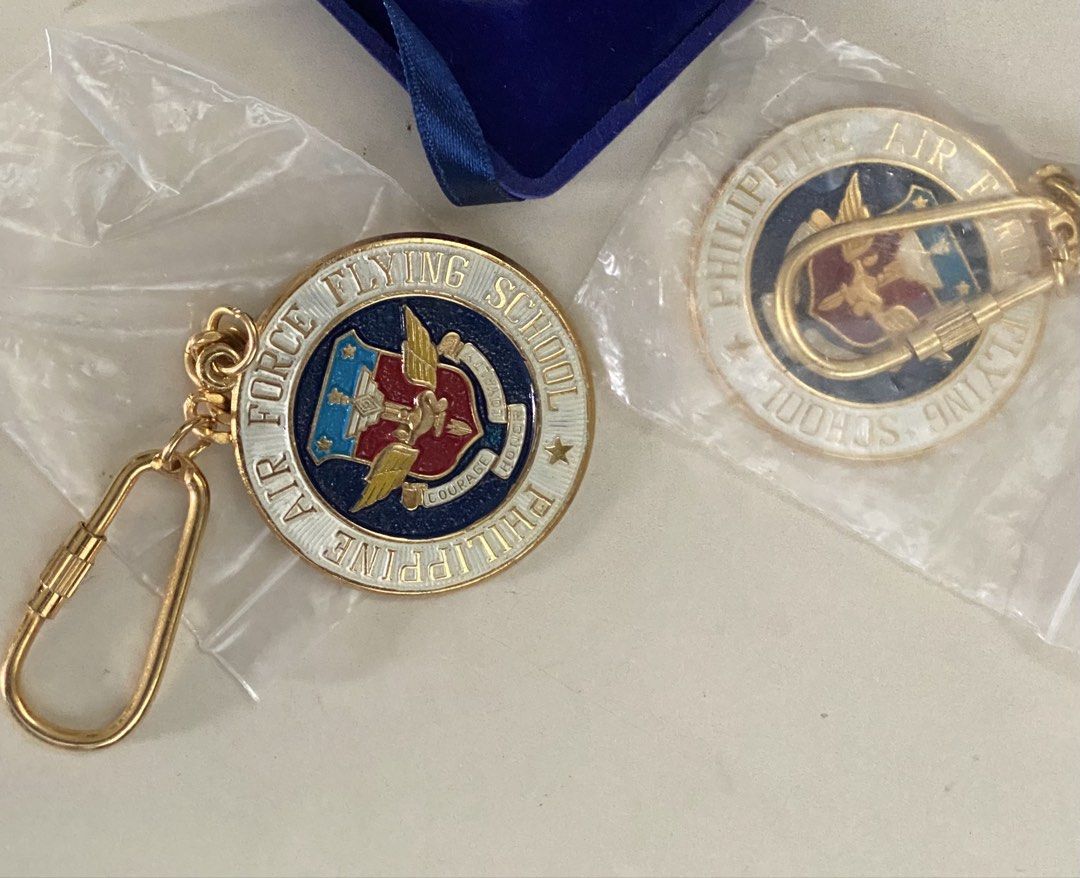 Philippine Air Force Flying School Keychain Set (Category: Vintage Collectibles) located in Cebu City. Submitted by bred_bt (Listing ID 1463023327, Image 1). Description: - Set of 2 Philippine Air Force Flying School keychains - Features the official school emblem on both keychains - One keychain includes a durable gold carabiner clip - The second keychain has a classic gold loop attachment - Ideal for collectors or anyone with a connection to th